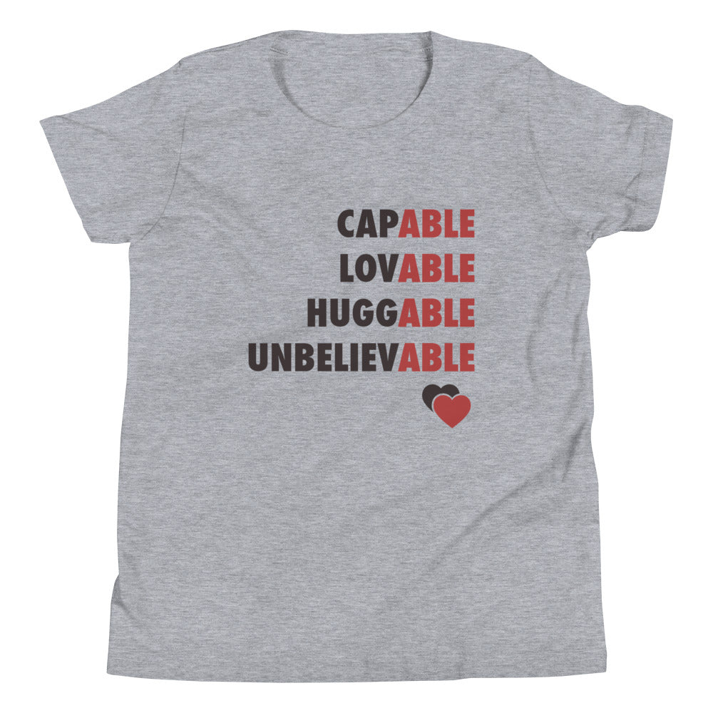 Capable, Huggable, Lovable, Unbelievable | Youth Short Sleeve Tee